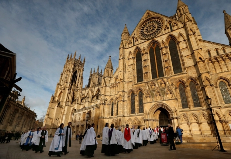 Members of the clergy enter York Minster before a service to consecrate Reverend Libby Lane as the first female bishop in the Church of England, in York, northern England, January 26, 2015. | Reuters/Phil Noble