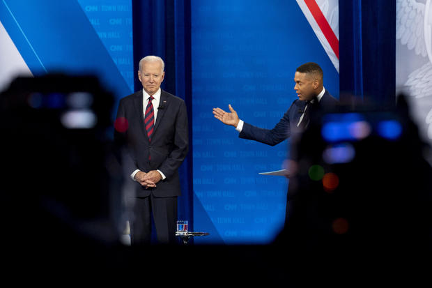 president biden standing with don lemon of cnn