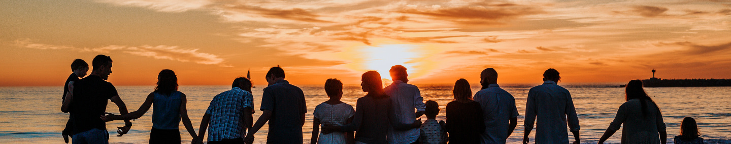 many people playing at sunset